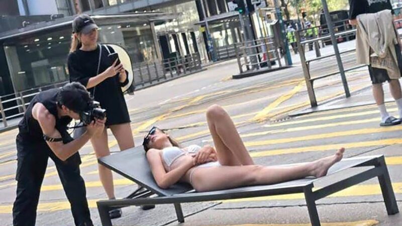 Woman in bikini on Hong Kong road crossing gets pulses racing on buses
