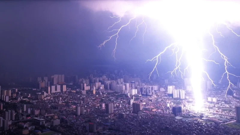 Lightning strikes Hanoi as storm floods streets at rush hour