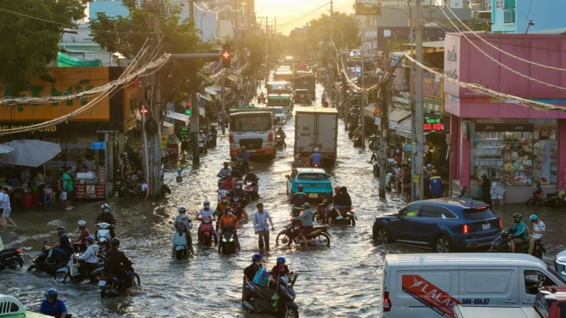 Residents wade through half-meter floodwaters as year’s highest tide swamps Ho Chi Minh City streets